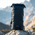 Ultralight foldable hiking daypack on a forest trail