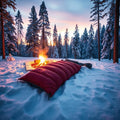 Red winter thermal sleeping bag in snowy forest at twilight